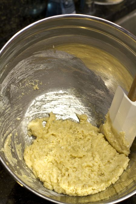 Adding egg whites to almond meal mixture