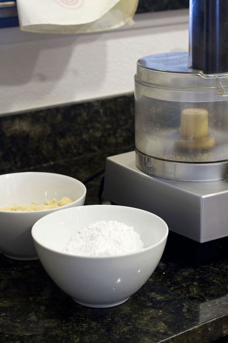Making macarons: almond meal and confectioners' sugar